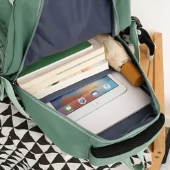 Pink Waterproof School Bags Nylon Backpack with Plush Monkey Keychain - Stylish and Durable School Bag with Multiple Pockets for Travel and Everyday Use