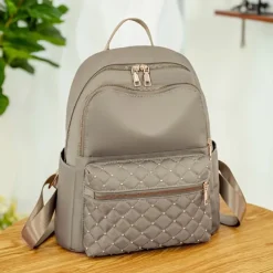 Women's Black Quilted Nylon Backpack with Gold Zippers and Studded Front Pocket – Stylish Lightweight Bag for School, Work, or Daily Use