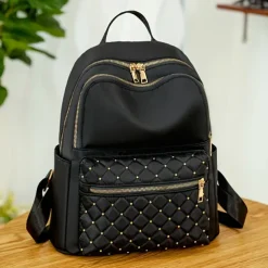 Women's Black Quilted Nylon Backpack with Gold Zippers and Studded Front Pocket – Stylish Lightweight Bag for School, Work, or Daily Use