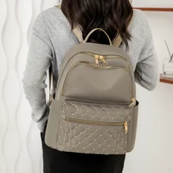 Women's Black Quilted Nylon Backpack with Gold Zippers and Studded Front Pocket – Stylish Lightweight Bag for School, Work, or Daily Use