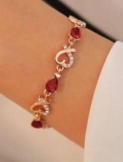 Women's Gold Bracelet with Red Teardrop Crystals and Heart-Shaped Accents, Elegant Romantic Design for Valentine's Day Gift, Weddings, and Special Occasions